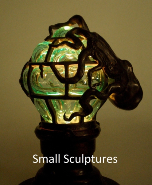 Globe lamp with octopus, bronze and glass